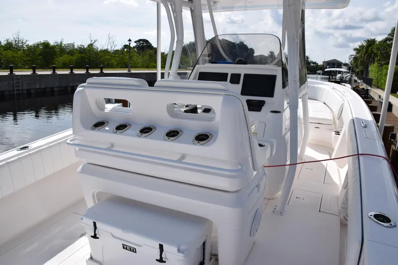  Yacht Photos Pics 2017 Intrepid 327 boat interior with helm and seating area.