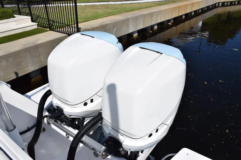  Yacht Photos Pics Twin outboard engines on a 2017 Intrepid 327 boat by the water.