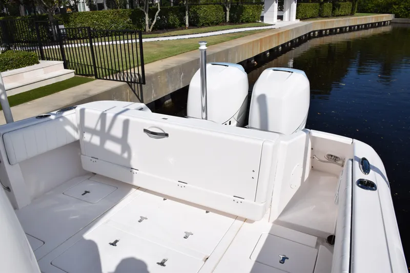  Yacht Photos Pics 2017 Intrepid 327 boat with dual engines docked by a canal.