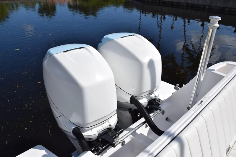  Yacht Photos Pics 2017 Intrepid 327 boat with dual outboard engines on calm water.