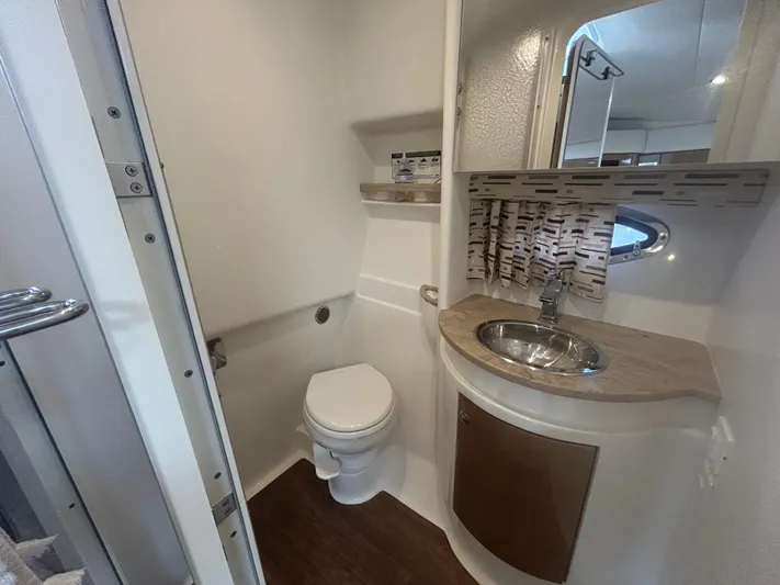  Yacht Photos Pics 2021 Formula 34 Performance Cruiser bathroom with modern sink, toilet, and stylish decor.