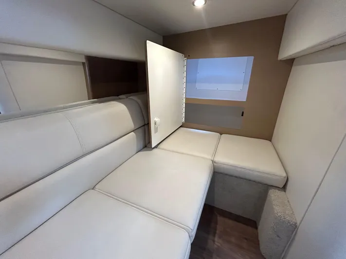  Yacht Photos Pics Interior of 2021 Formula 34 Performance Cruiser with beige seating and storage compartment.