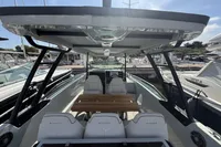 2023 Saxdor 270 GTO boat interior with seating and table, docked at marina.