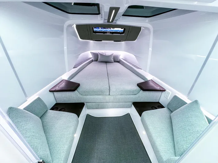  Yacht Photos Pics 2024 Axopar 37XC CROSS CABIN interior with modern, spacious sleeping area and seating.