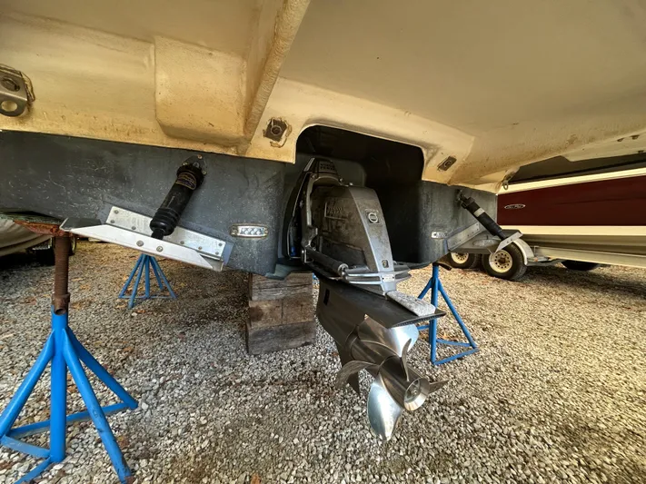  Yacht Photos Pics 2021 Regal 2800 Express boat on stands, showing propeller and stern drive.