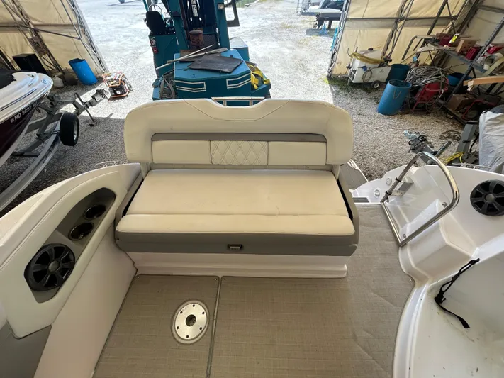  Yacht Photos Pics 2021 Regal 2800 Express boat interior with cushioned seating and speaker system.