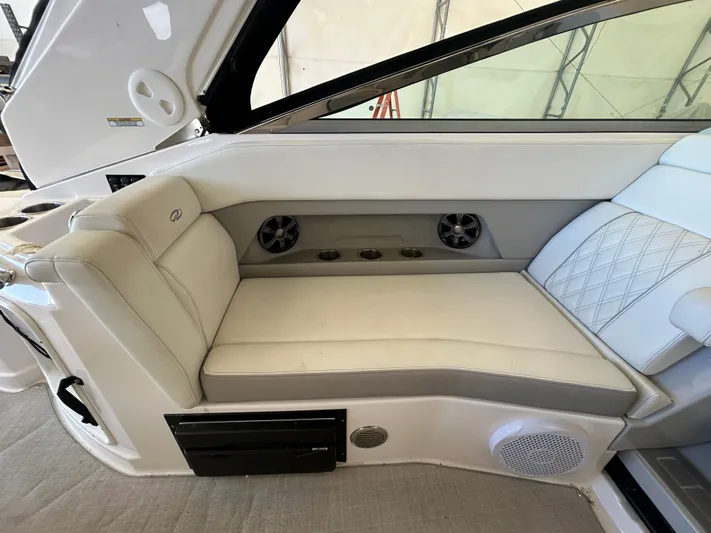  Yacht Photos Pics 2021 Regal 2800 Express boat interior with white seating and built-in speakers.
