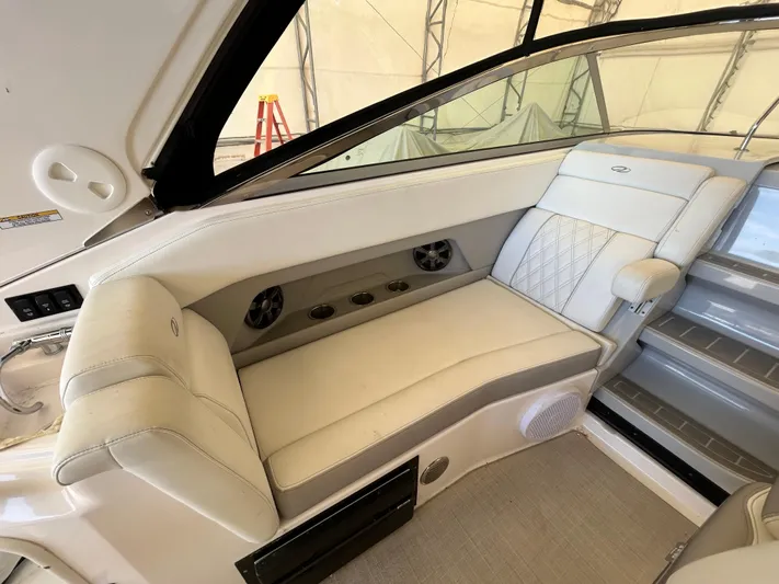  Yacht Photos Pics 2021 Regal 2800 Express boat interior with white leather seating and modern design.