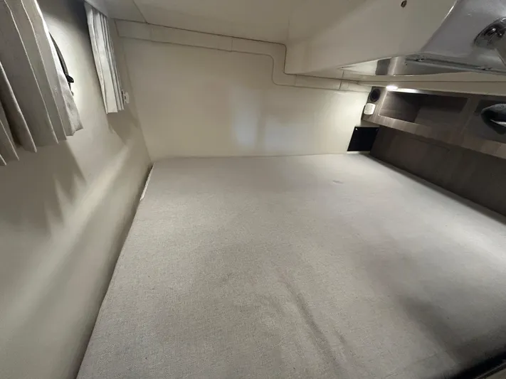  Yacht Photos Pics 2021 Regal 2800 Express cabin interior with spacious sleeping area and modern design.