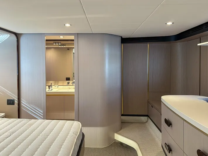  Yacht Photos Pics Luxurious interior of 2024 Azimut 60 Fly yacht, featuring modern bedroom and bathroom design.