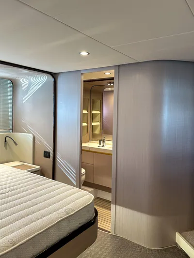  Yacht Photos Pics 2024 Azimut 60 Fly yacht interior with modern bedroom and ensuite bathroom.