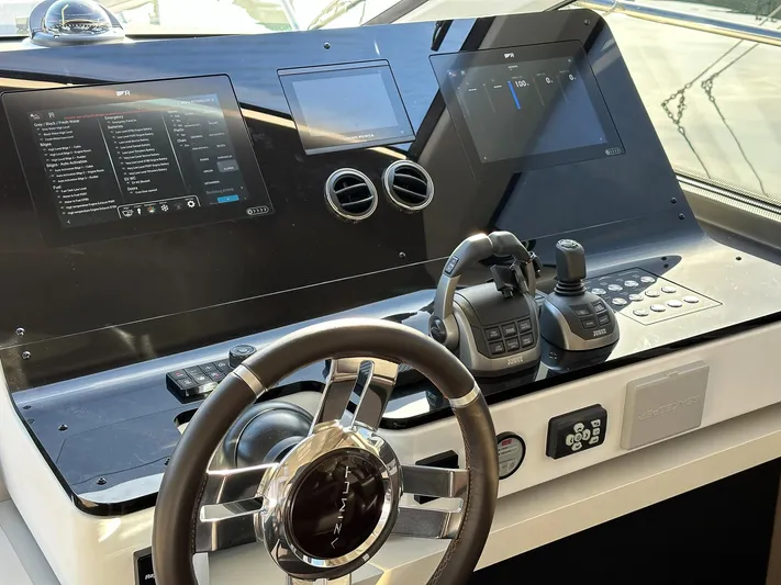  Yacht Photos Pics 2024 Azimut 60 Flybridge yacht helm with modern controls and dual displays.