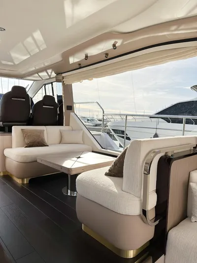  Yacht Photos Pics Luxurious interior of 2024 Azimut 60 Fly yacht with elegant seating and panoramic views.
