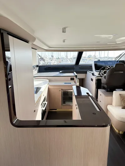  Yacht Photos Pics 2024 Azimut 60 Fly yacht interior with modern kitchen and helm station.