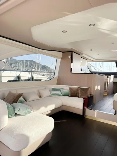  Yacht Photos Pics Luxurious interior of 2024 Azimut 60 Fly yacht with elegant seating and panoramic windows.