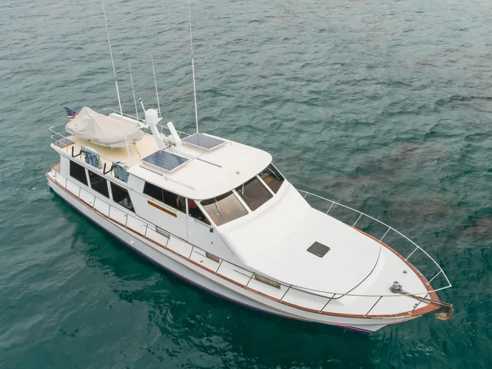 Vin Santo Yacht Photos Pics 1984 Vic Franck pilothouse yacht on open water, featuring solar panels and sleek design.