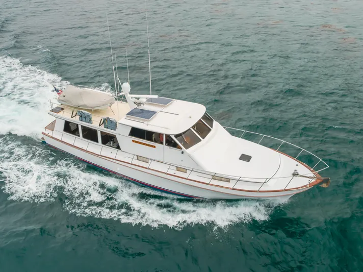 Vin Santo Yacht Photos Pics 1984 Vic Franck pilothouse yacht cruising on open water.