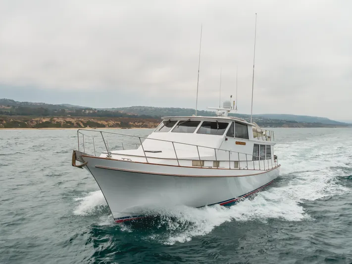 Vin Santo Yacht Photos Pics 1984 Vic Franck pilothouse yacht cruising on open water.