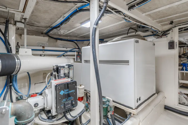 Vin Santo Yacht Photos Pics Engine room of 1984 Vic Franck pilothouse with Sea Recovery system and piping.