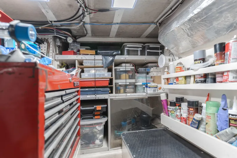 Vin Santo Yacht Photos Pics Workshop area inside a 1984 Vic Franck pilothouse, featuring organized tools and supplies.