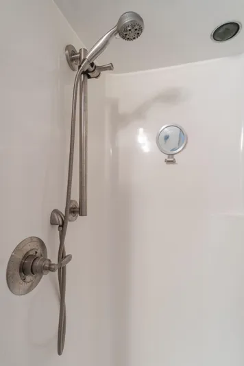 Vin Santo Yacht Photos Pics Shower area in 1984 Vic Franck pilothouse with handheld showerhead and control valve.