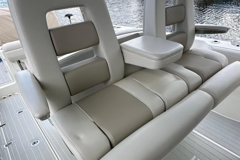  Yacht Photos Pics 2020 Boston Whaler 330 Outrage boat seating with armrests and cushioned backrests.