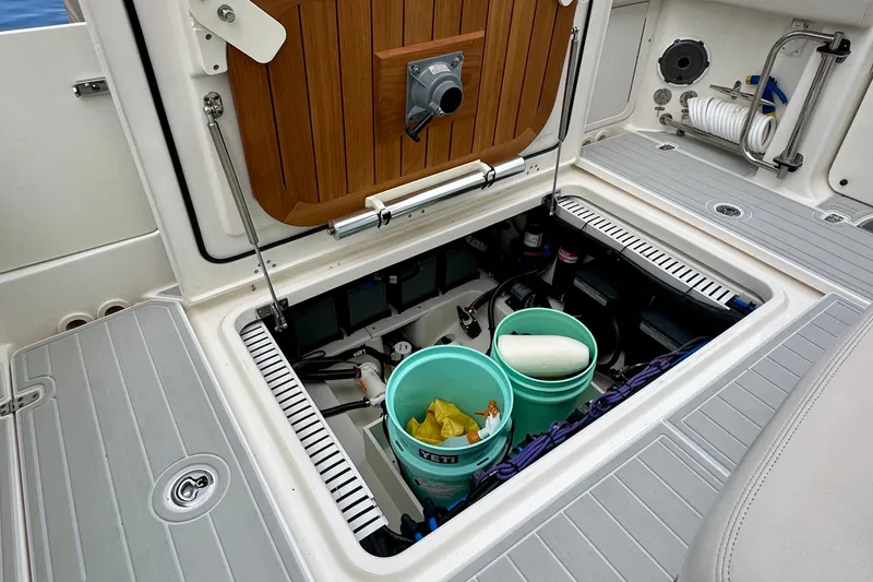  Yacht Photos Pics Storage compartment of 2020 Boston Whaler 330 Outrage boat with equipment and supplies.