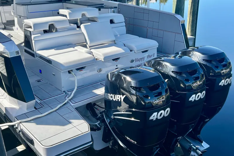 Happy Our II Yacht Photos Pics 2022 Aviara AV40 OB boat with triple Mercury 400 outboard engines, featuring luxurious seating.