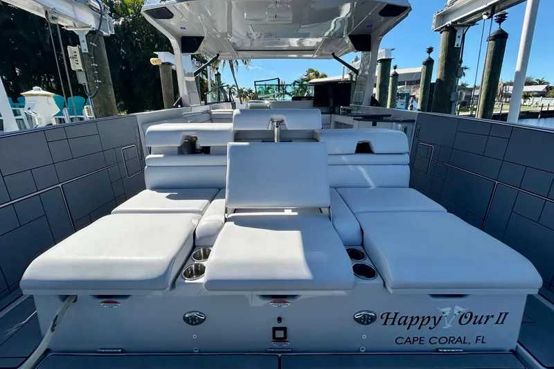 Happy Our II Yacht Photos Pics 2022 Aviara AV40 OB luxury boat interior with plush seating, docked in Cape Coral, FL.