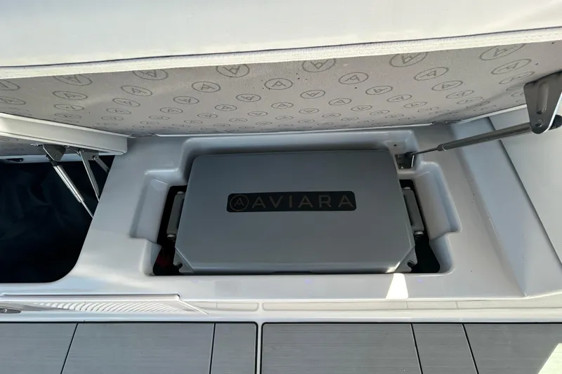 Happy Our II Yacht Photos Pics 2022 Aviara AV40 OB storage compartment with branded cover, showcasing sleek design and functionality.