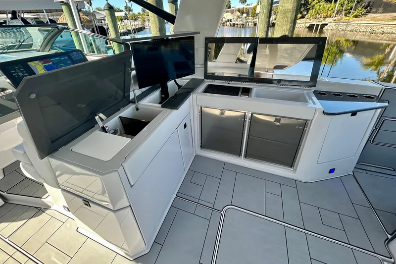 Happy Our II Yacht Photos Pics Luxurious 2022 Aviara AV40 OB yacht interior with modern kitchen and navigation screens.