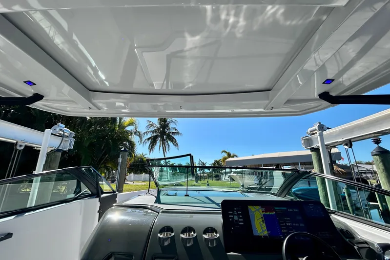 Happy Our II Yacht Photos Pics Interior view of 2022 Aviara AV40 OB boat with modern dashboard and open roof.