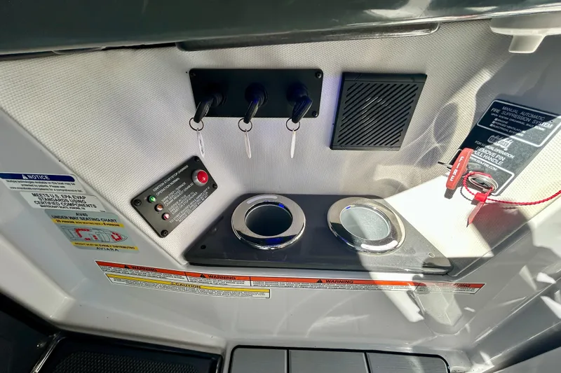 Happy Our II Yacht Photos Pics Control panel of 2022 Aviara AV40 OB boat with ignition keys and safety features.
