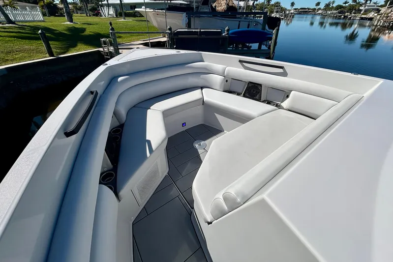 Happy Our II Yacht Photos Pics 2022 Aviara AV40 OB boat with spacious white seating area docked by calm waters.