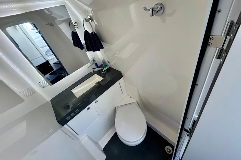 Happy Our II Yacht Photos Pics Luxurious 2022 Aviara AV40 OB boat bathroom with modern fixtures and sleek design.