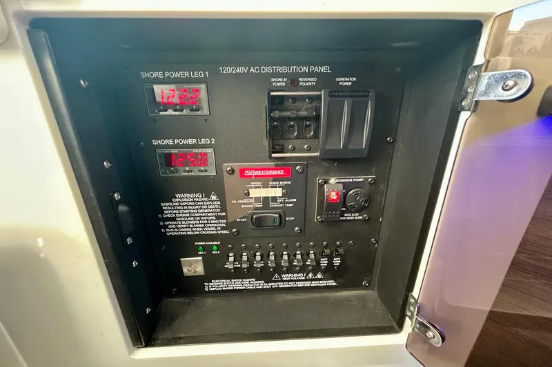 Happy Our II Yacht Photos Pics 2022 Aviara AV40 OB electrical distribution panel with voltage readings and control switches.