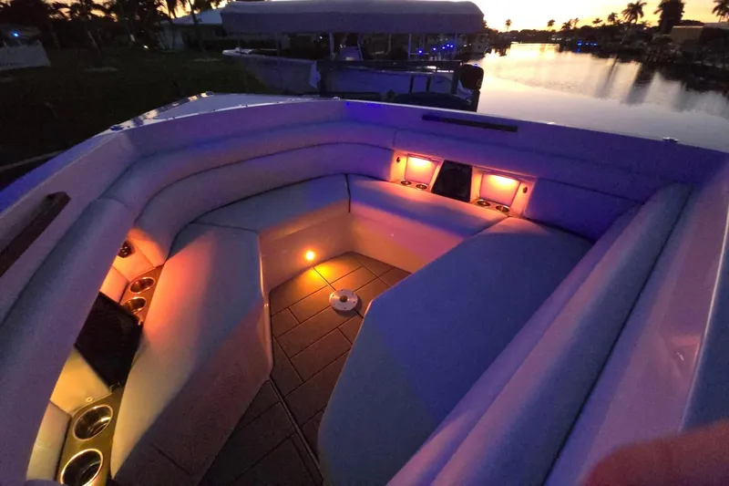 Happy Our II Yacht Photos Pics 2022 Aviara AV40 OB boat interior with ambient lighting at sunset.