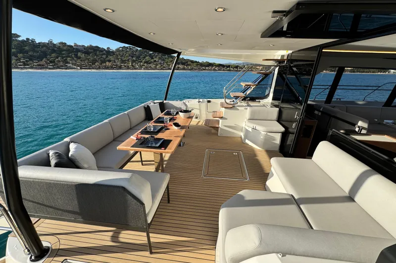  Yacht Photos Pics Luxurious 2024 Prestige M48 yacht deck with elegant seating and ocean view.