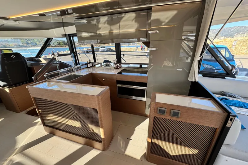  Yacht Photos Pics Luxurious 2024 Prestige M48 yacht interior with modern kitchen design and sleek finishes.