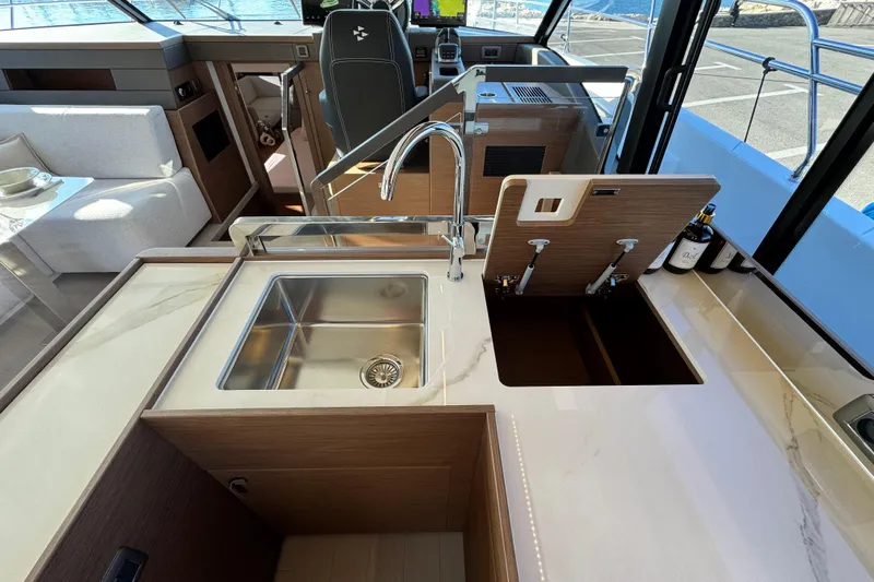  Yacht Photos Pics Luxurious 2024 Prestige M48 yacht kitchen with modern sink and elegant countertop design.