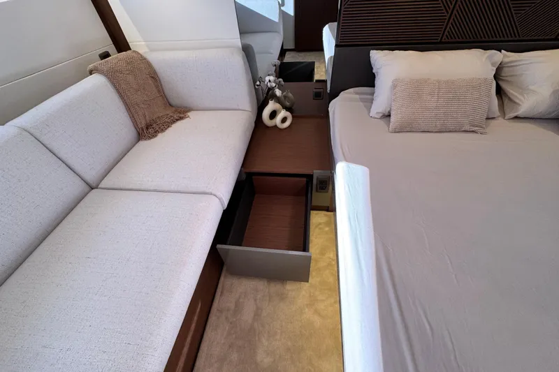  Yacht Photos Pics Luxurious interior of 2024 Prestige M48 yacht with sofa, bed, and elegant decor.