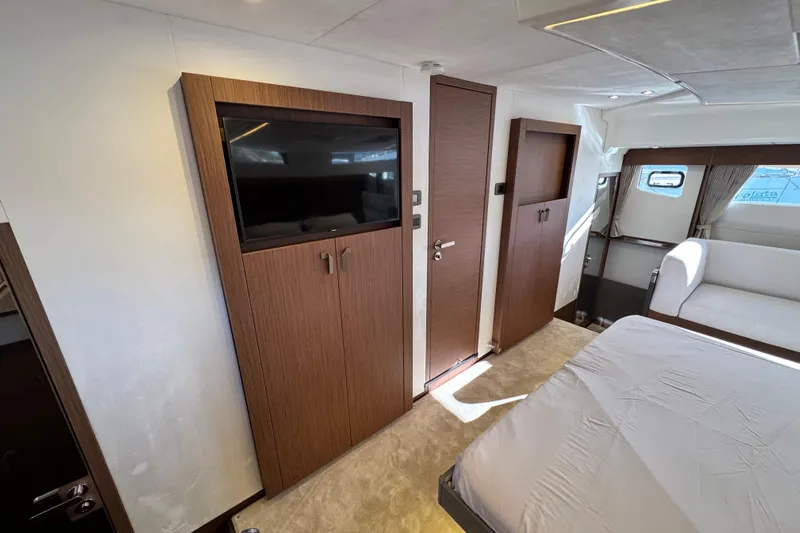 Yacht Photos Pics Luxurious interior of 2024 Prestige M48 yacht featuring modern wood paneling and elegant furnishings.