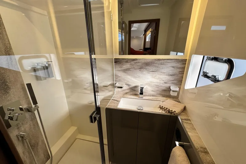  Yacht Photos Pics Luxurious bathroom in 2024 Prestige M48 yacht with modern fixtures and elegant design.