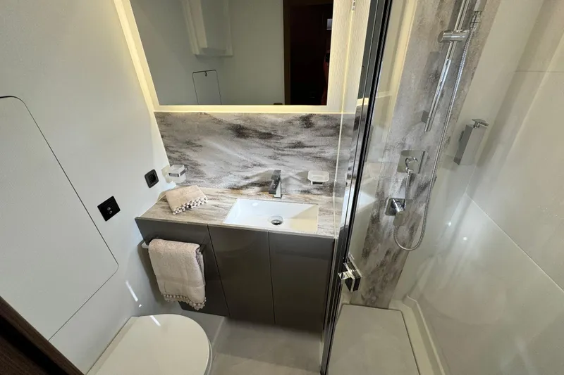  Yacht Photos Pics Modern bathroom in 2024 Prestige M48 yacht with sleek fixtures and elegant design.