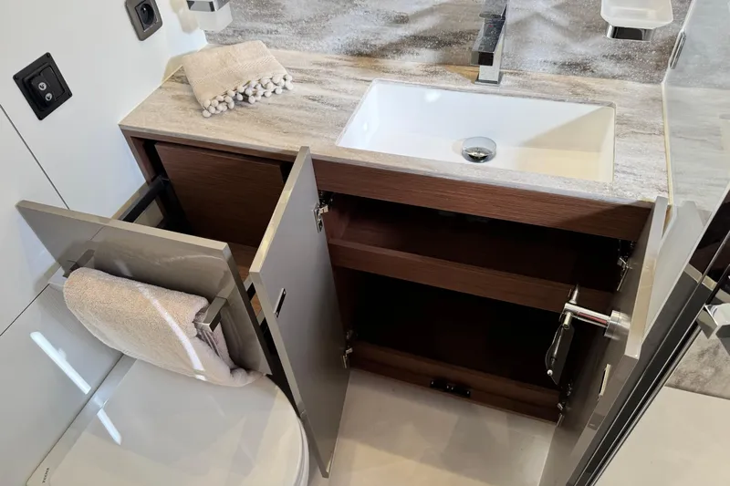  Yacht Photos Pics Modern bathroom vanity with open cabinets in 2024 Prestige M48 model.