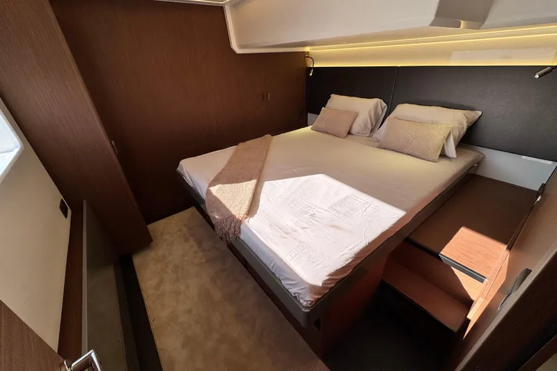  Yacht Photos Pics Luxurious cabin interior of 2024 Prestige M48 yacht with cozy bed and modern design.