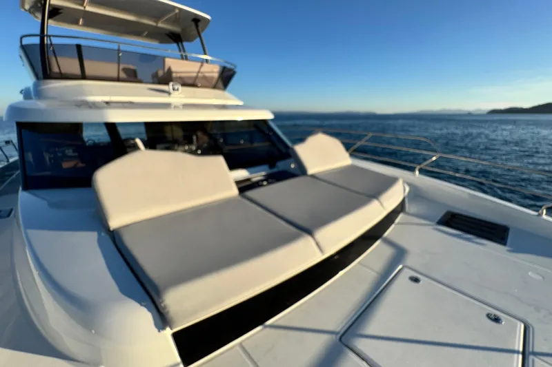  Yacht Photos Pics 2024 Prestige M48 yacht with sun deck, cruising on open water.