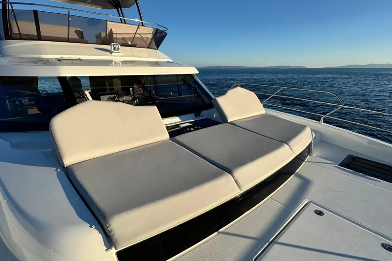  Yacht Photos Pics Prestige M48 2024 yacht with sun loungers on deck, ocean view.