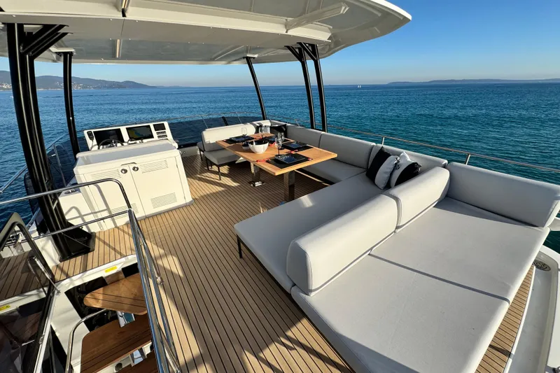  Yacht Photos Pics Luxurious 2024 Prestige M48 yacht deck with elegant seating and ocean view.