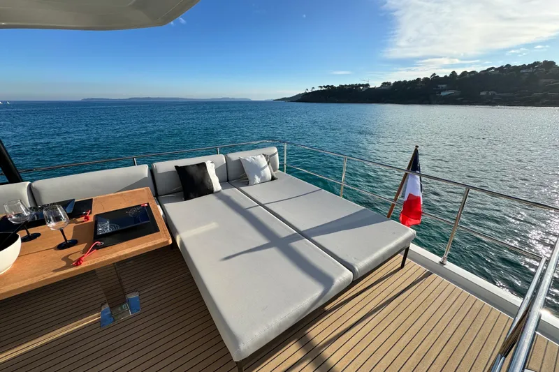  Yacht Photos Pics Luxurious 2024 Prestige M48 yacht deck with sun loungers and ocean view.